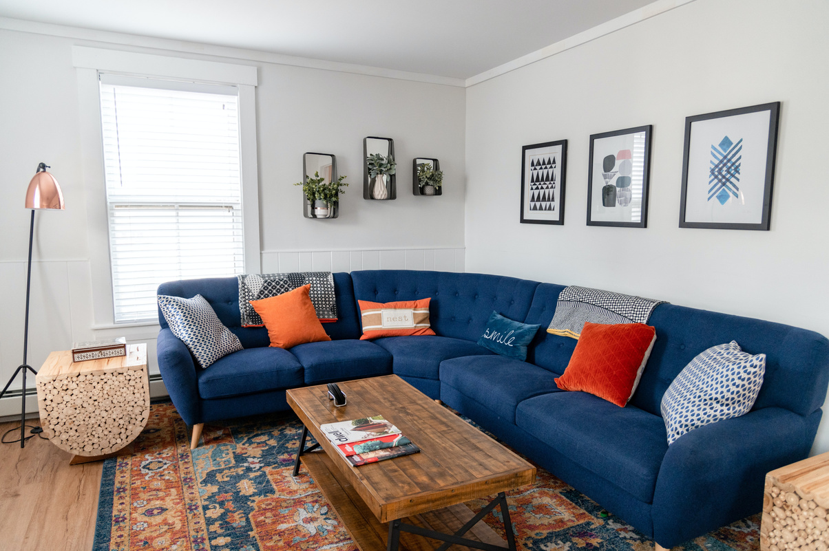 Blue and White Sofa With Throw Pillows